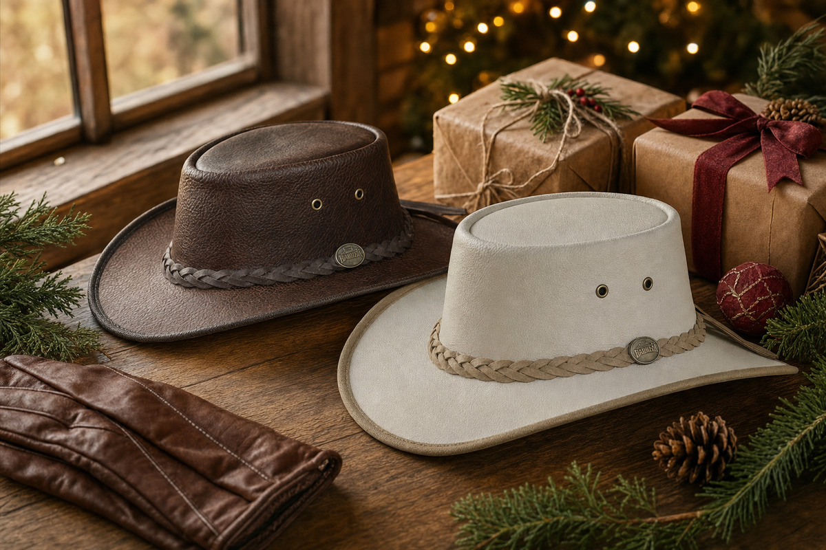 Bison leather and pearl goat leather outback hats with Christmas gifts wrapped in kraft paper on a cabin table